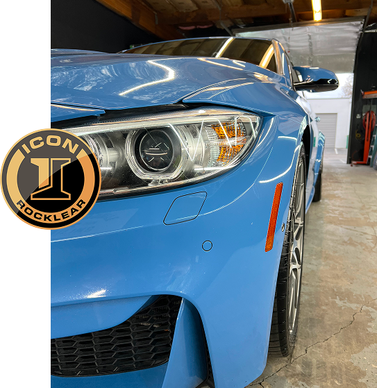 photo of a blue BMW in the Raw Coatings & Detailing garage