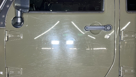 photo of a military green jeep before application of Icon Rocklear, showing color swirls